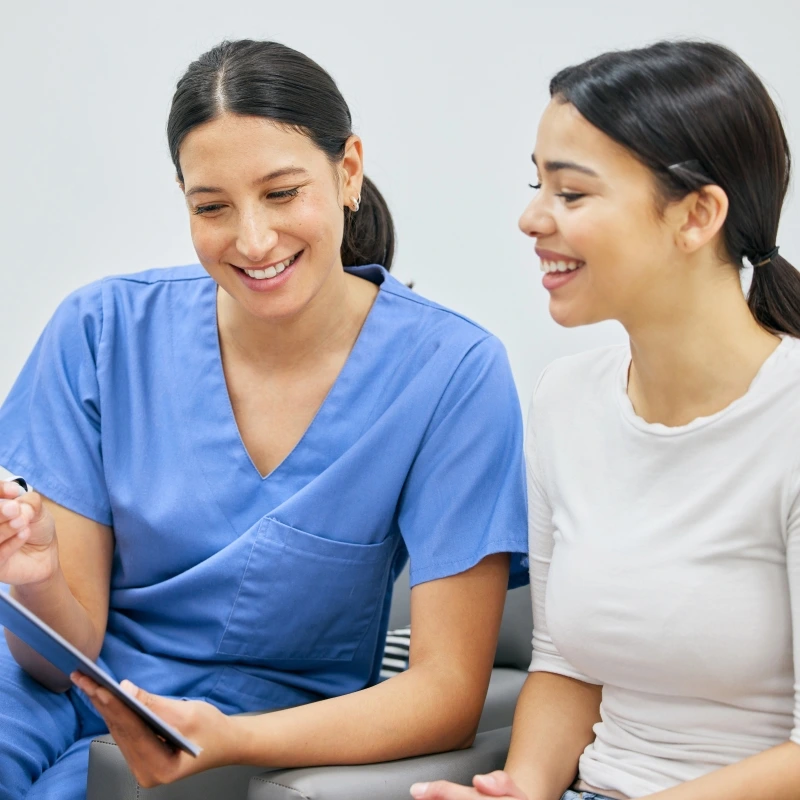 Stratford dentist reviewing dental insurance with a patient.